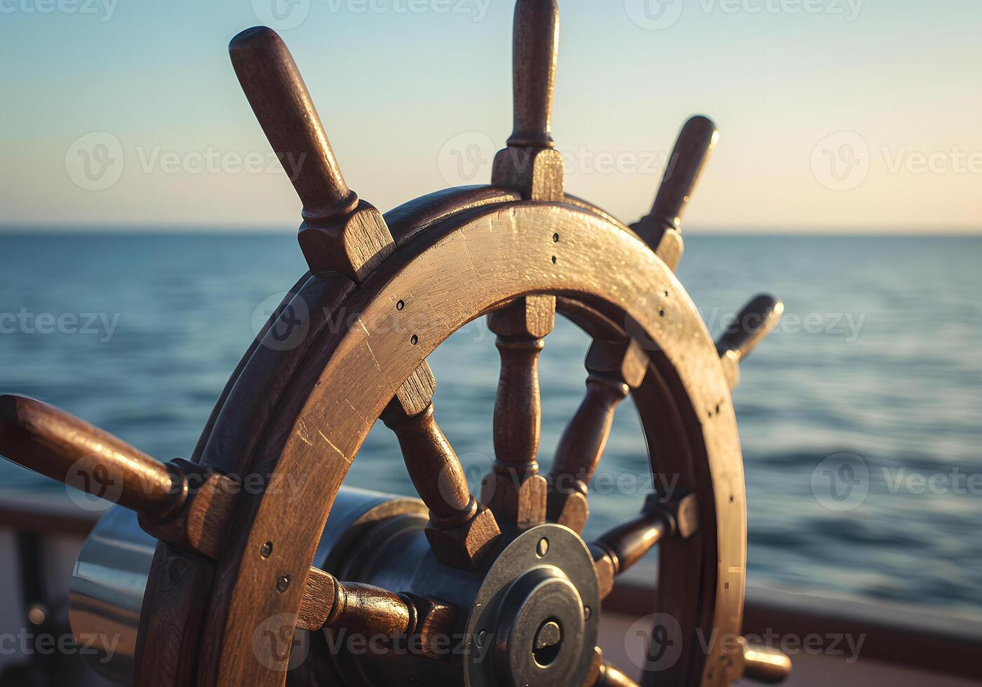 A close up of a wooden steering wheel on a boat photo