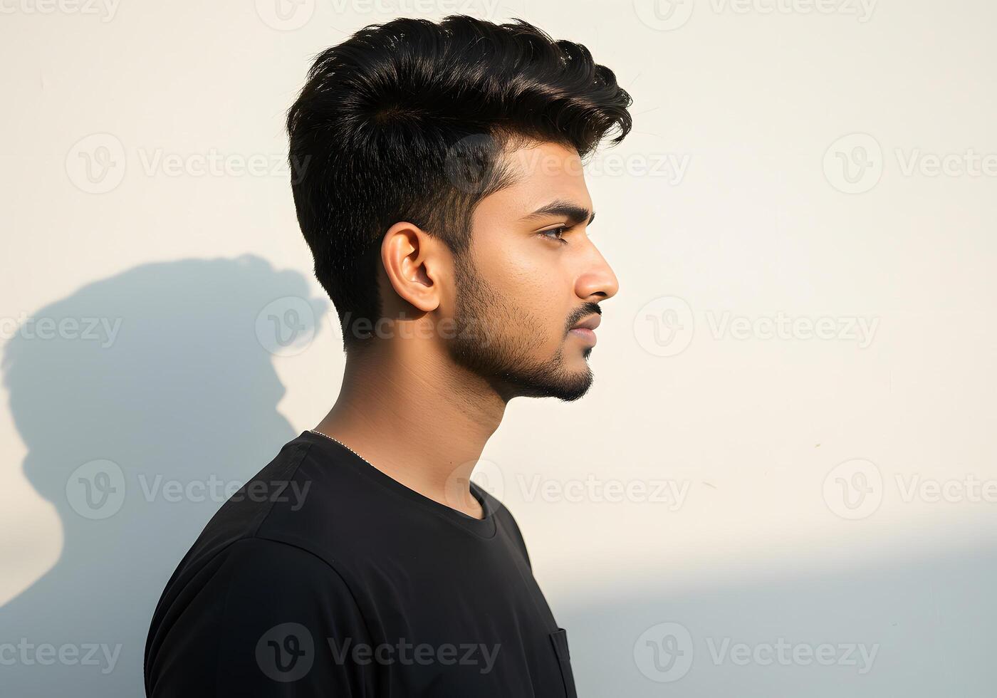 A man with a black shirt and a shadow photo
