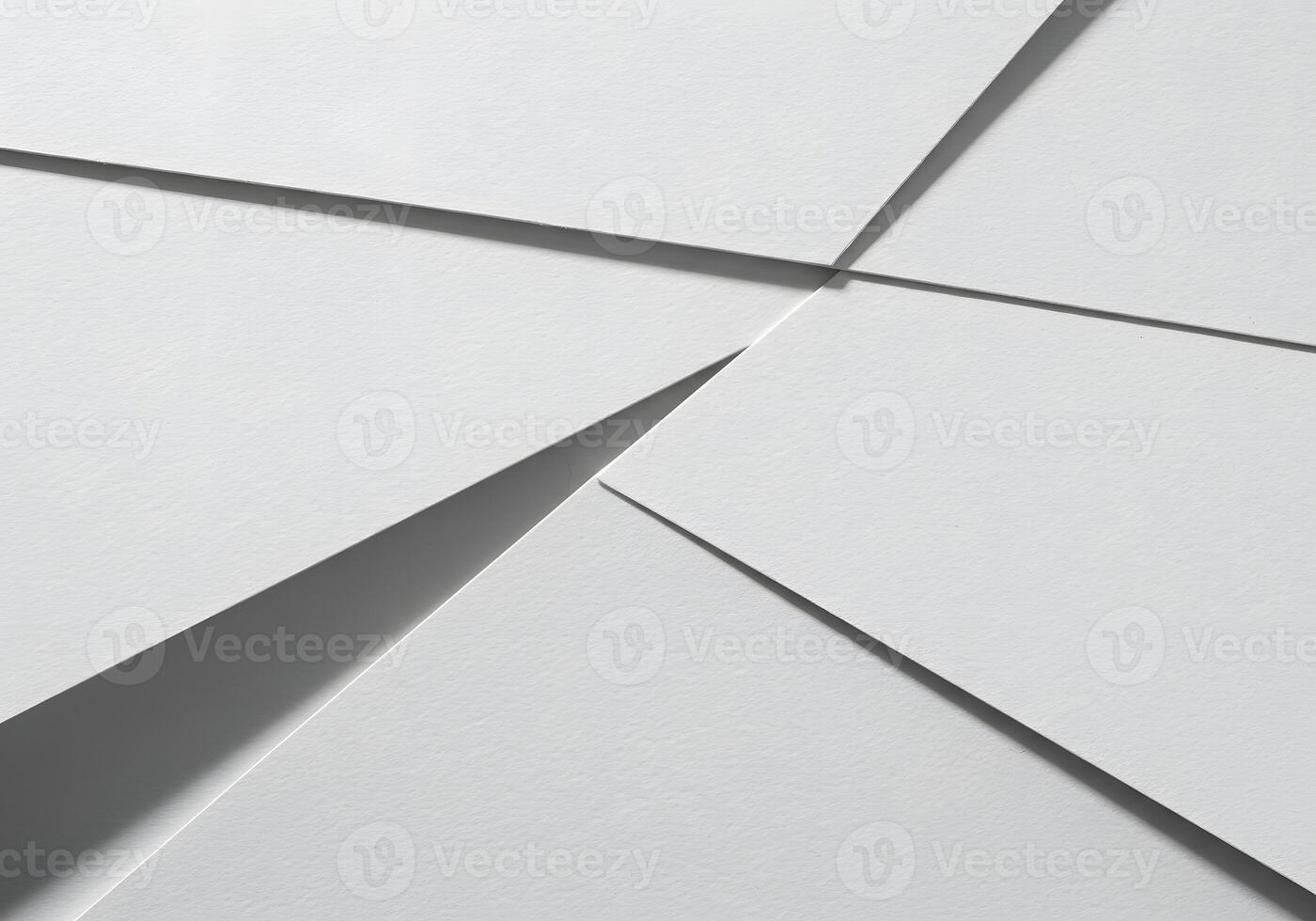White paper background with a few pieces of paper photo