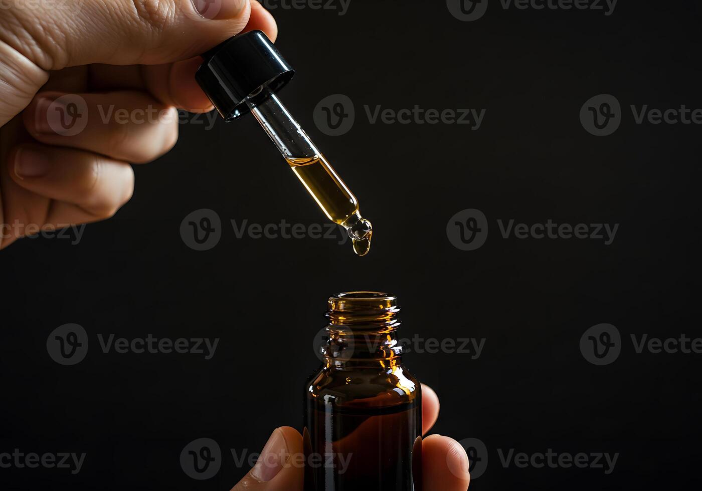 A person holding a bottle of cbd oil photo