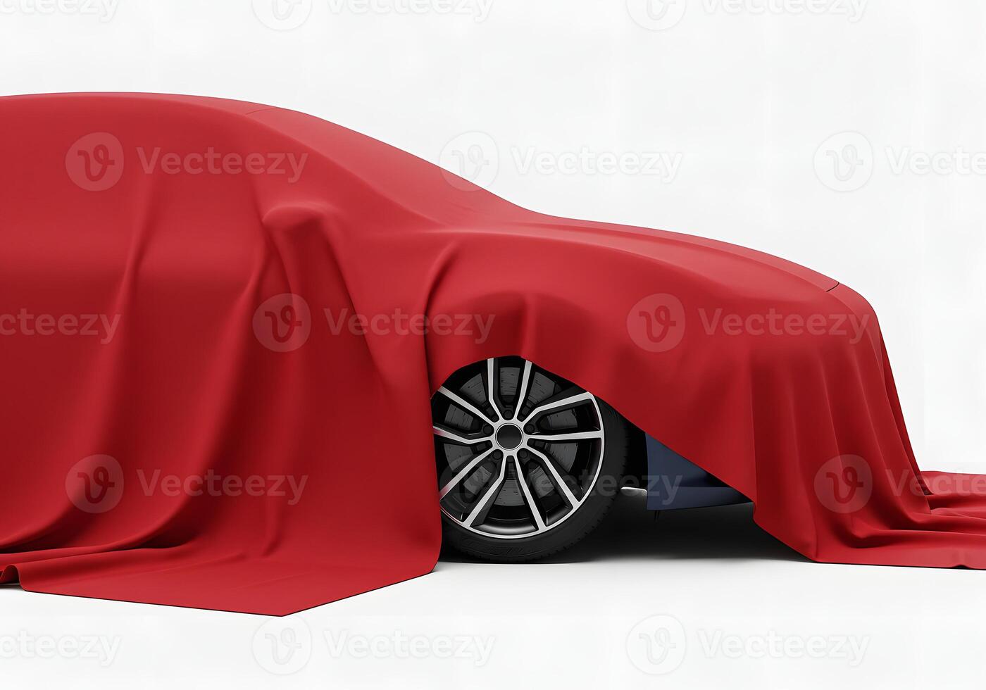A red car covered in a red cloth photo