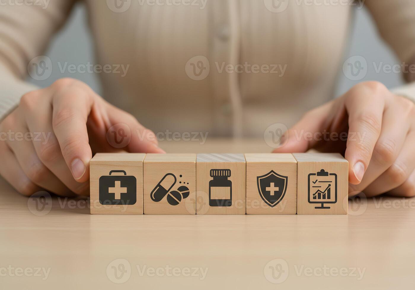 A person holding wooden blocks with icons on them photo