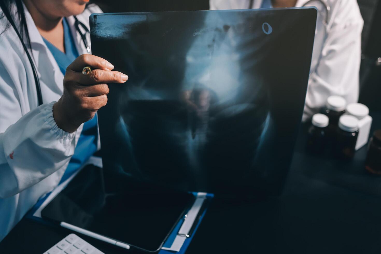 A doctor is looking at an x - ray image photo