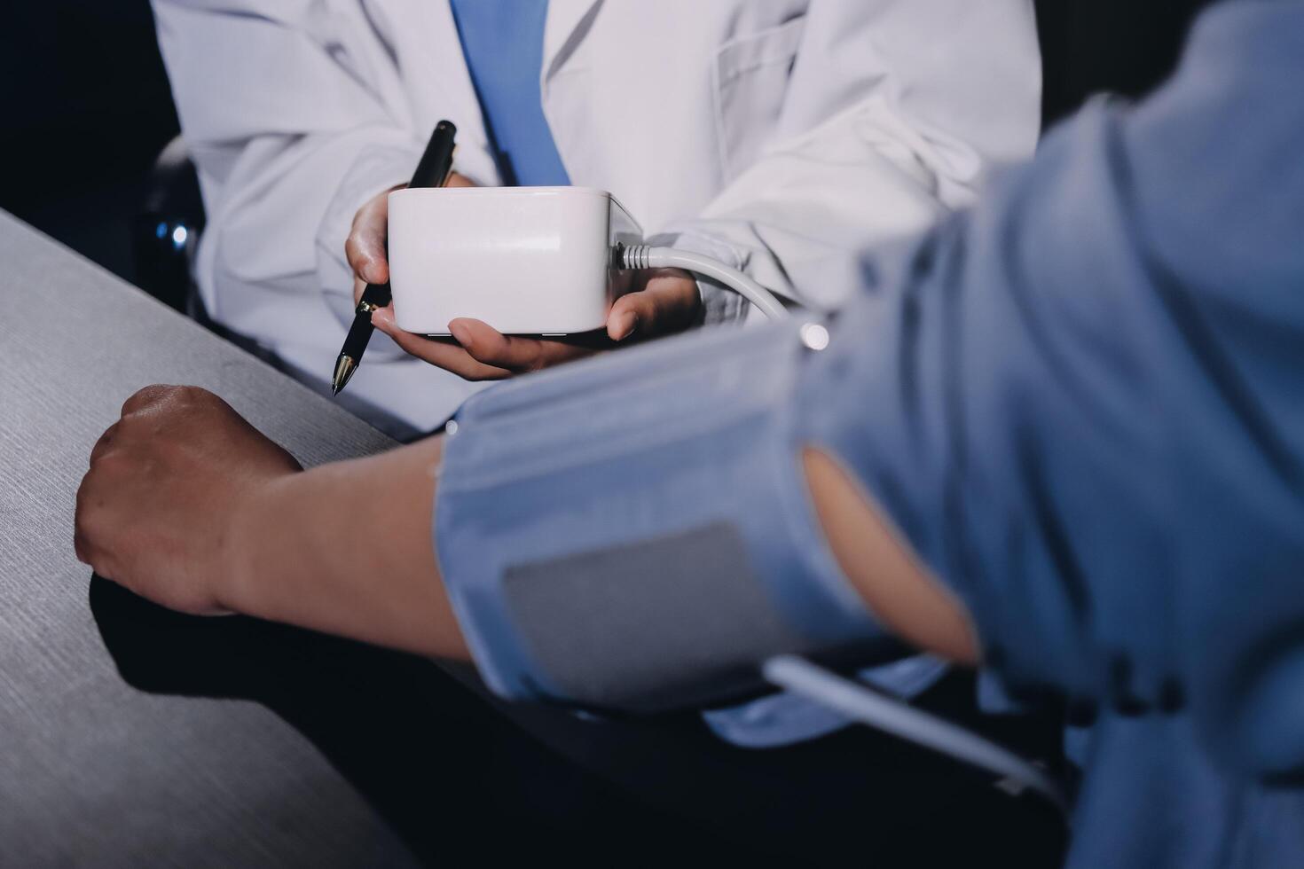 A doctor is holding a white box photo