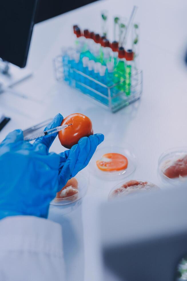 A person in a lab coat holding an orange photo