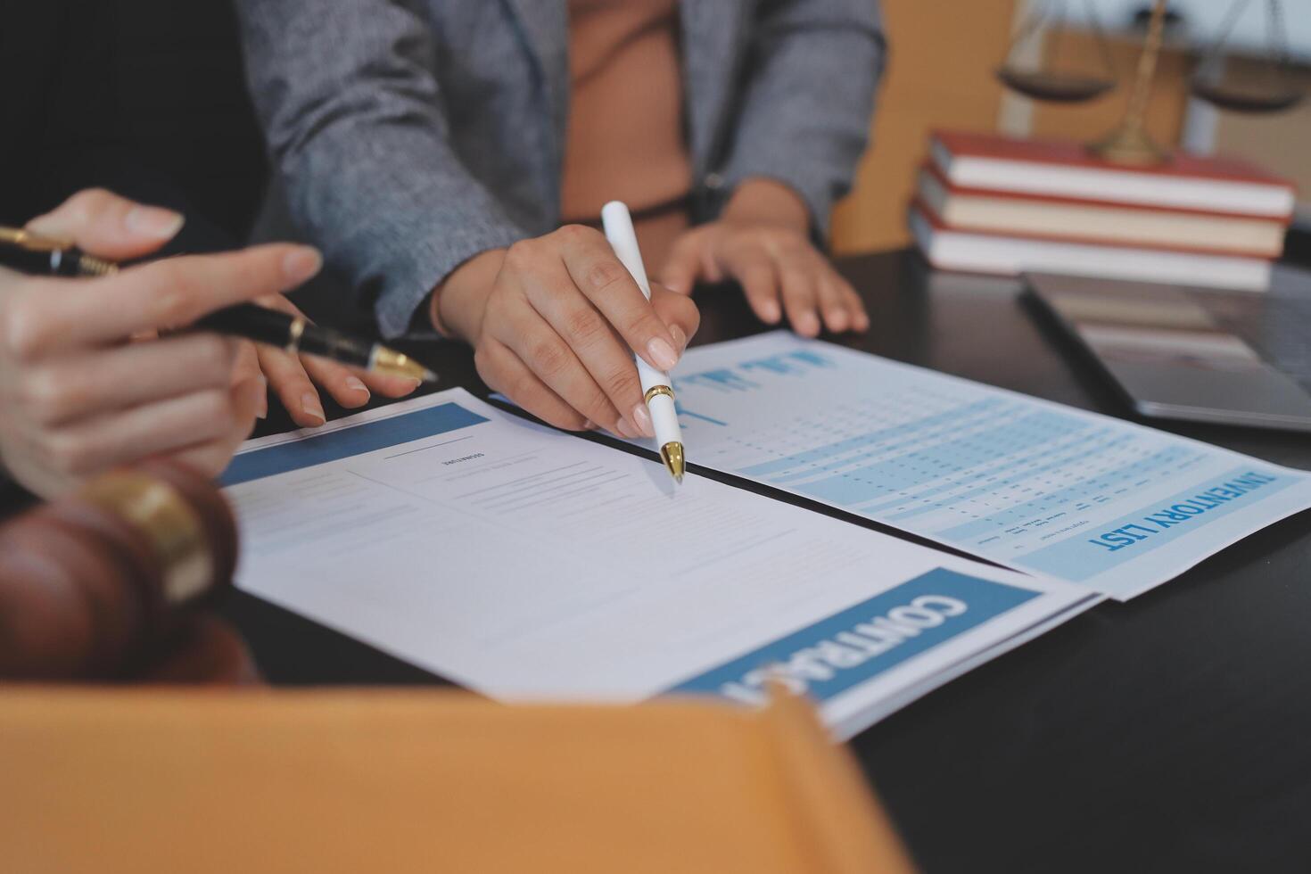 Businessman signing documents with pen and paper photo