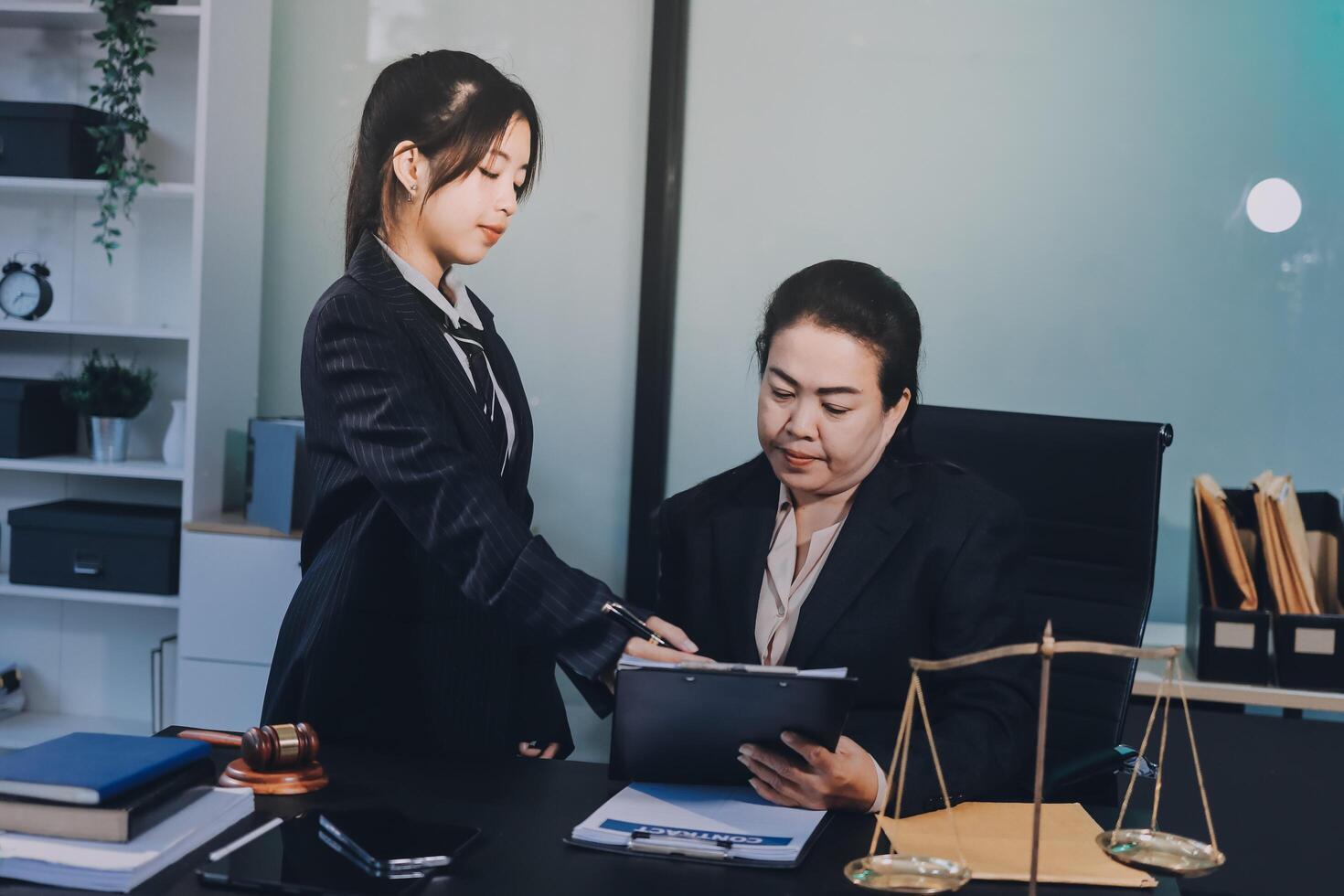 Asian woman lawyer and client in office photo