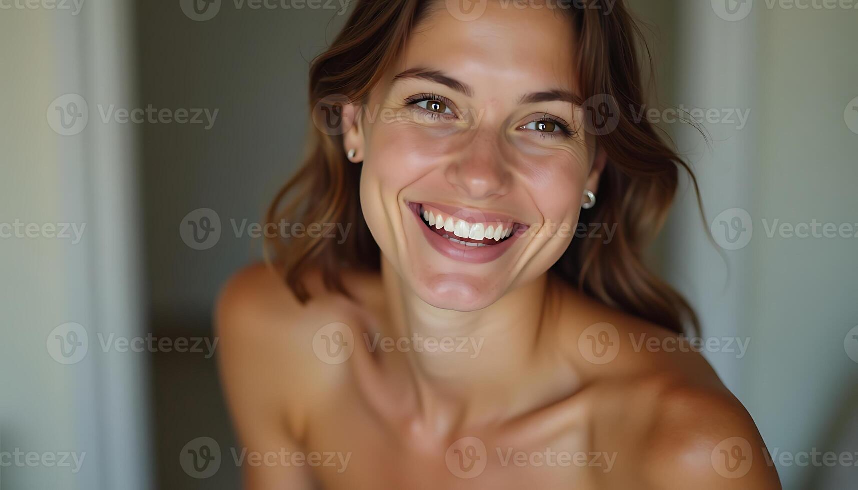 A woman smiling while looking at the camera photo