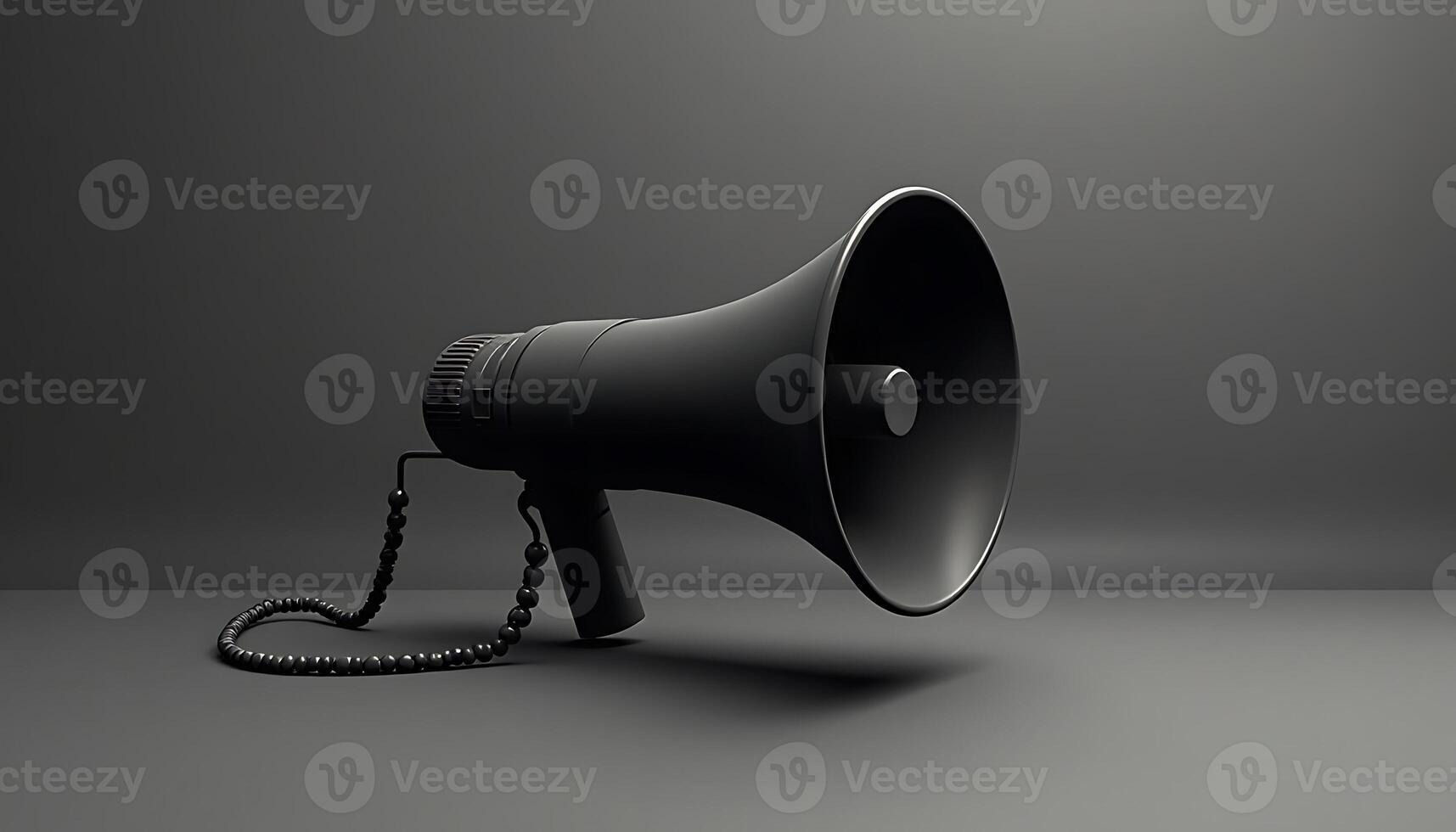 A black megaphone on a gray background photo