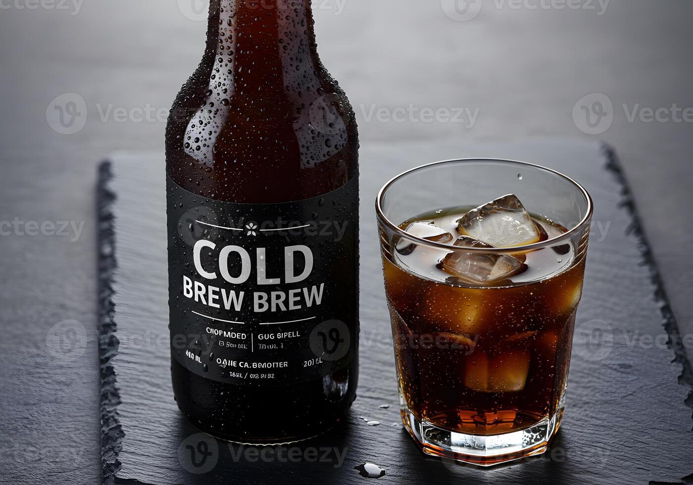 Cold brew bottle and glass with ice cubes on a dark surface photo
