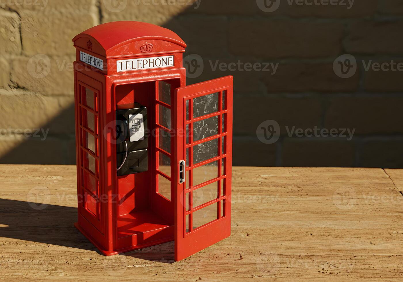Bright red telephone booth with open door overhead view conceptual shot photo
