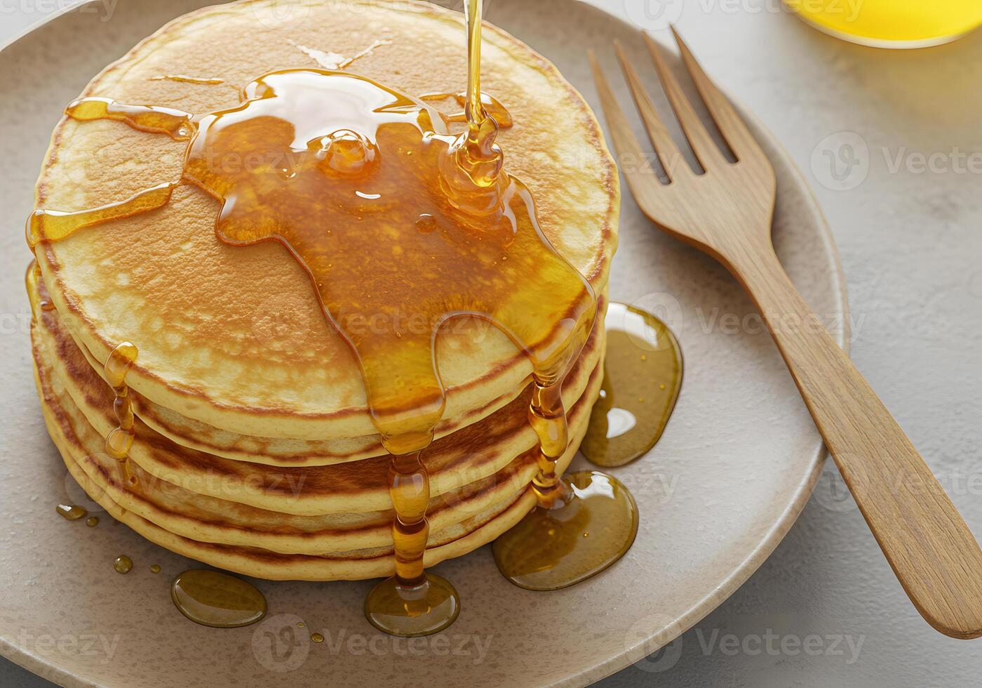 Stack of pancakes with syrup on plate breakfast food overhead view photo
