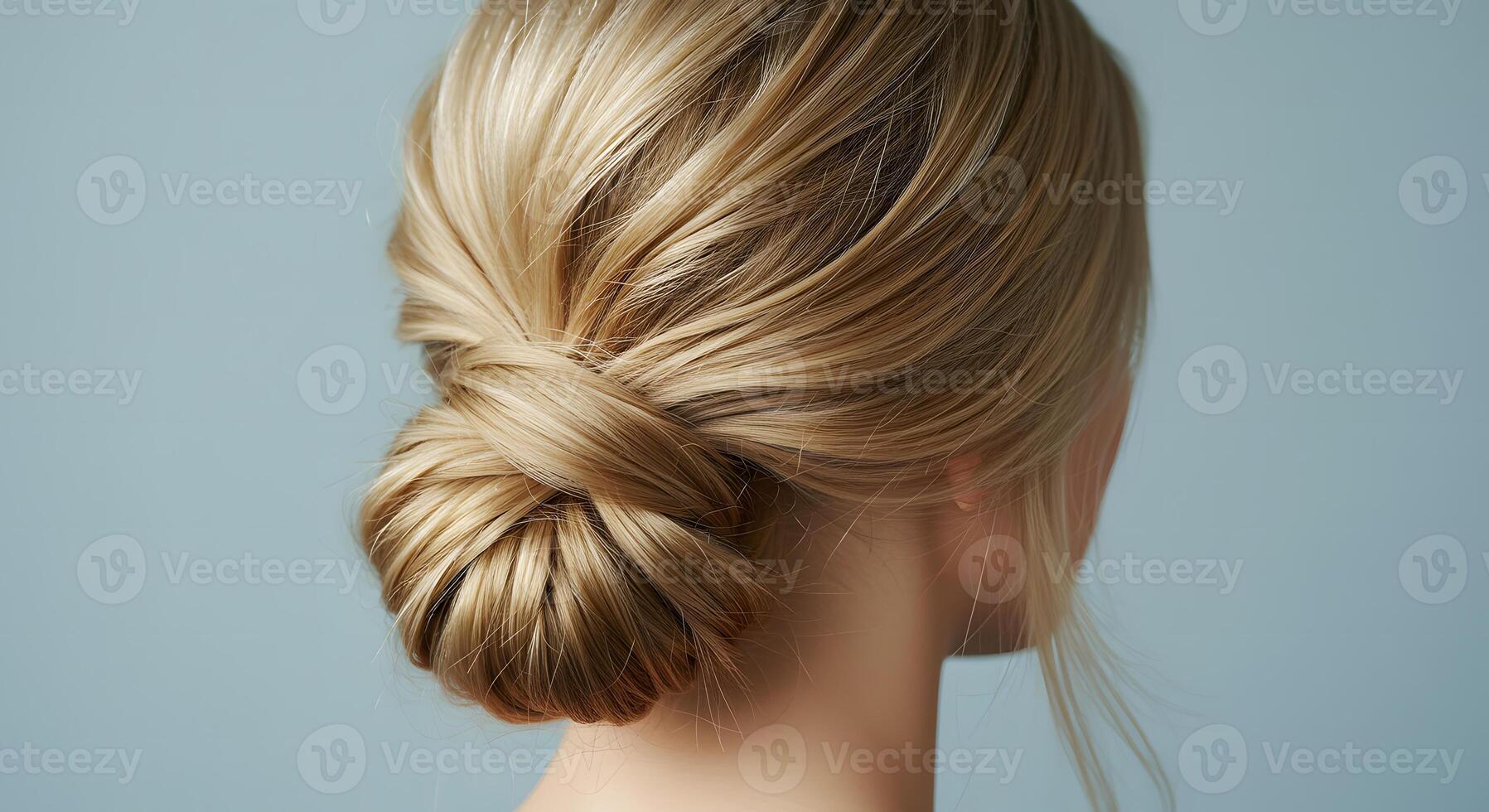Stylish blonde woman bun hairstyle photo