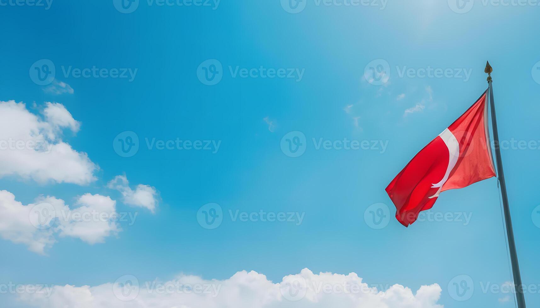 Red flag against blue sky photo