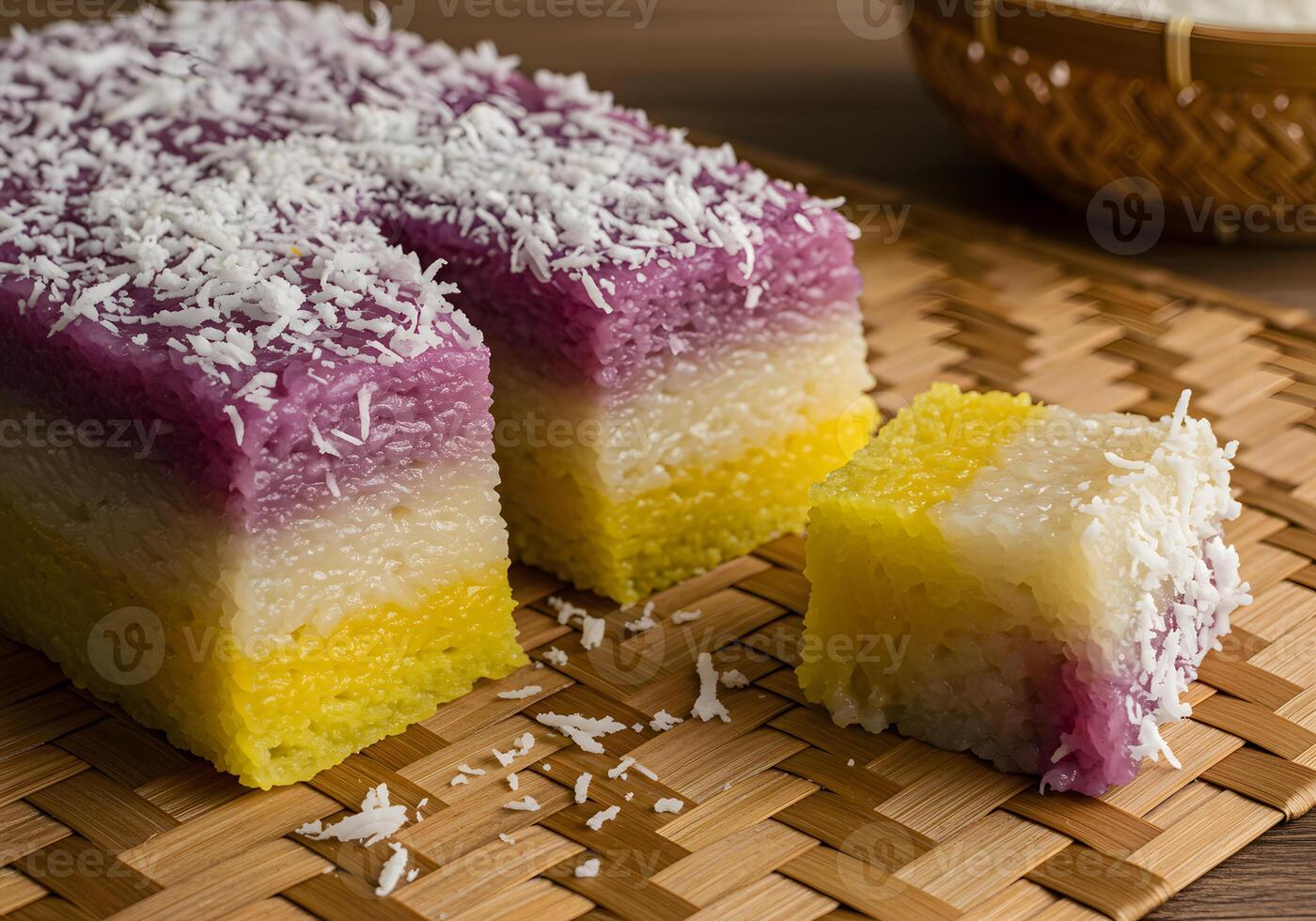 Colorful layered dessert slices on woven mat photo