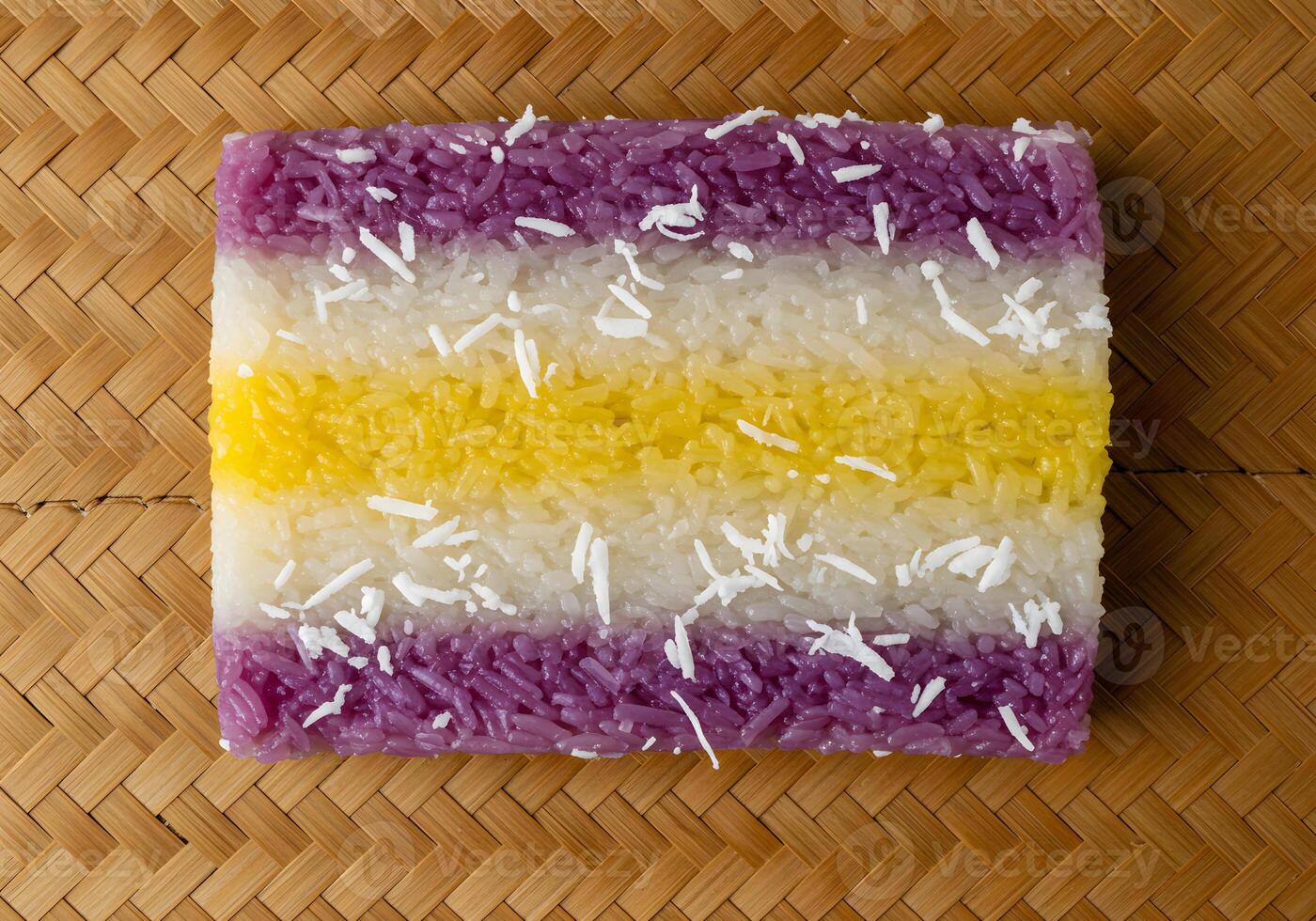 Colorful striped rice dessert on woven background photo