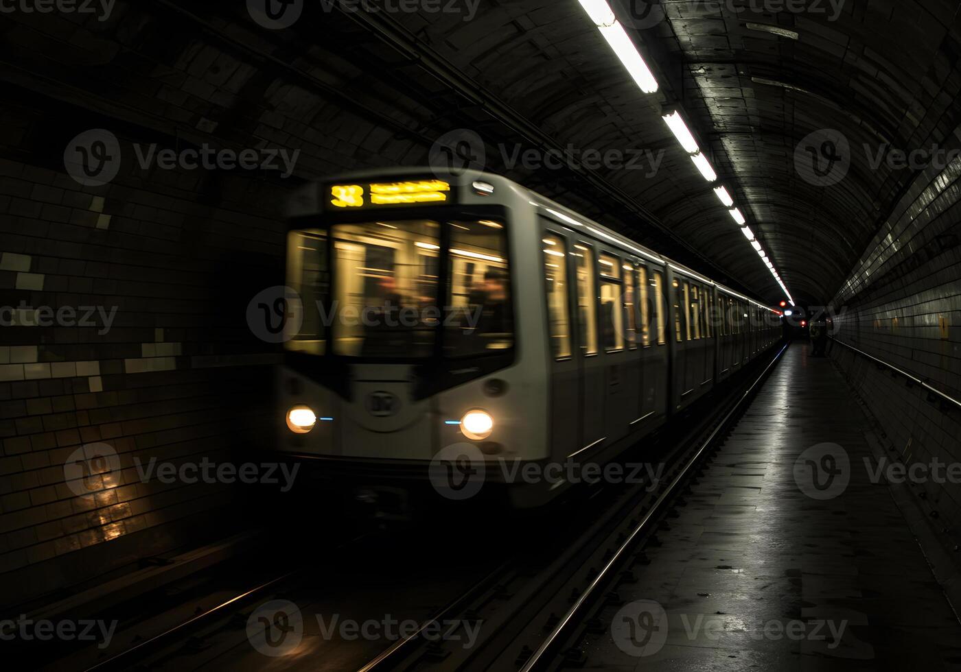 Subway train in underground tunnel photo