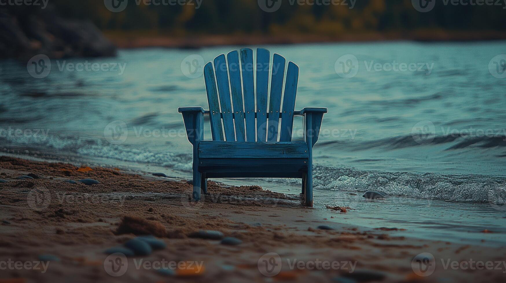 A blue chair sitting on the beach photo