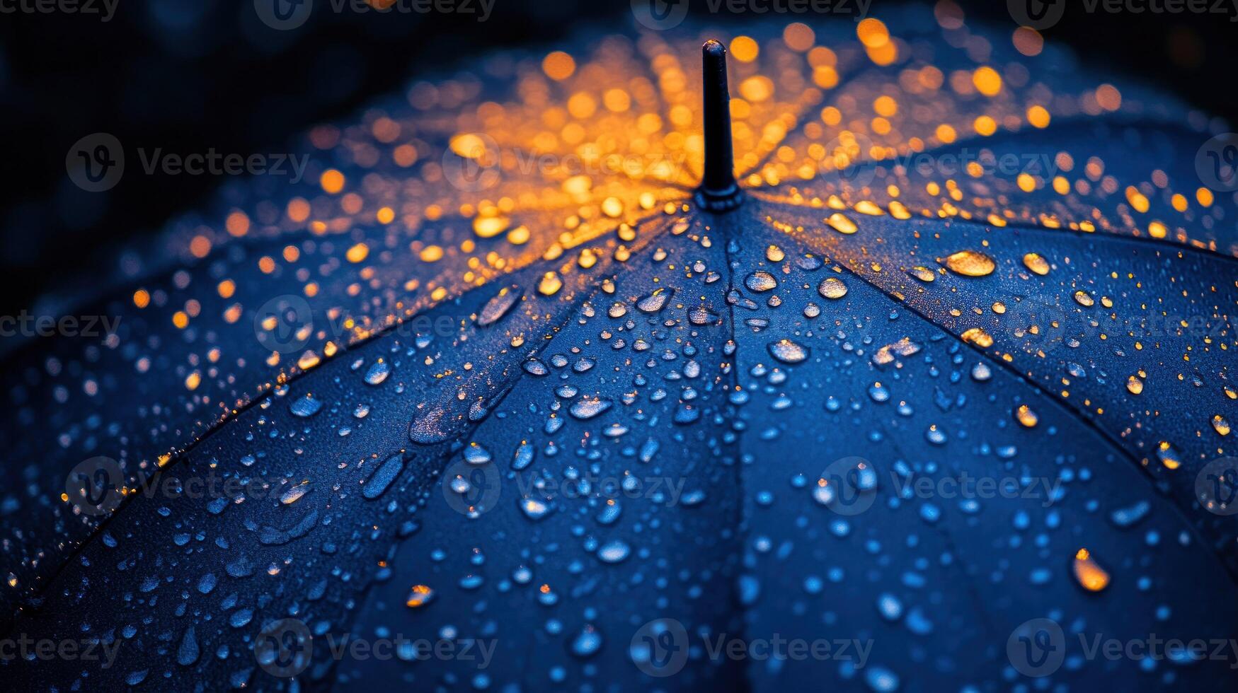 A close up of a blue umbrella with water droplets photo