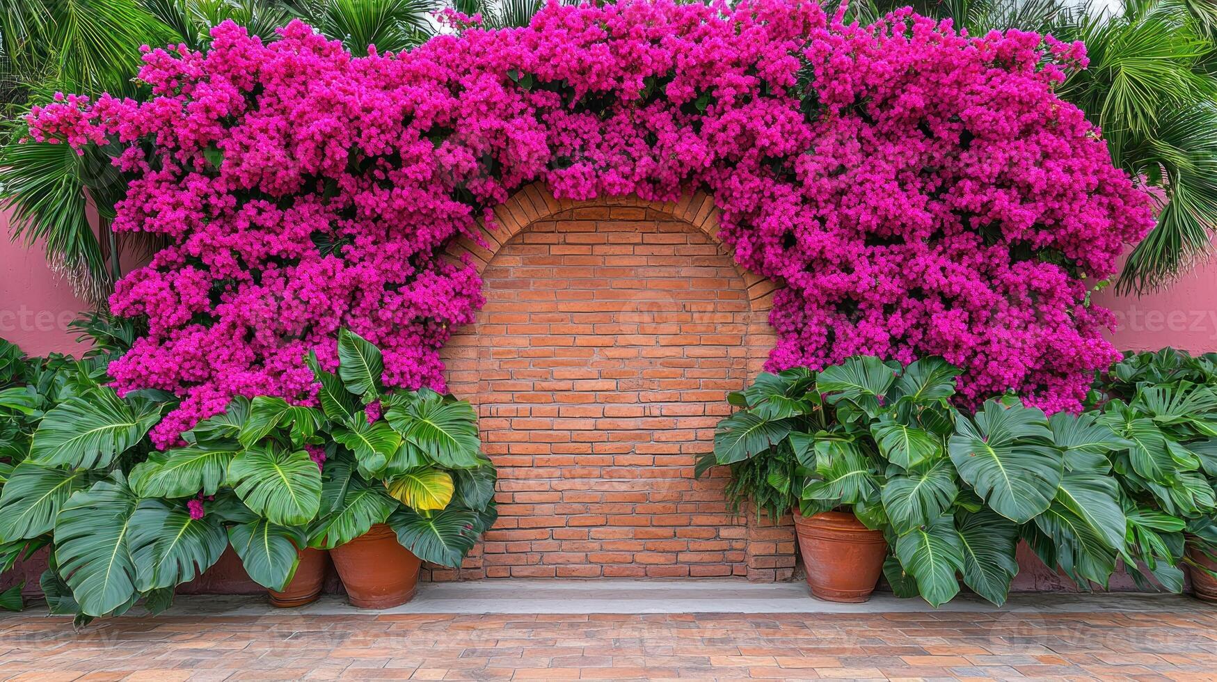 A wall with a large pink flower growing on it photo