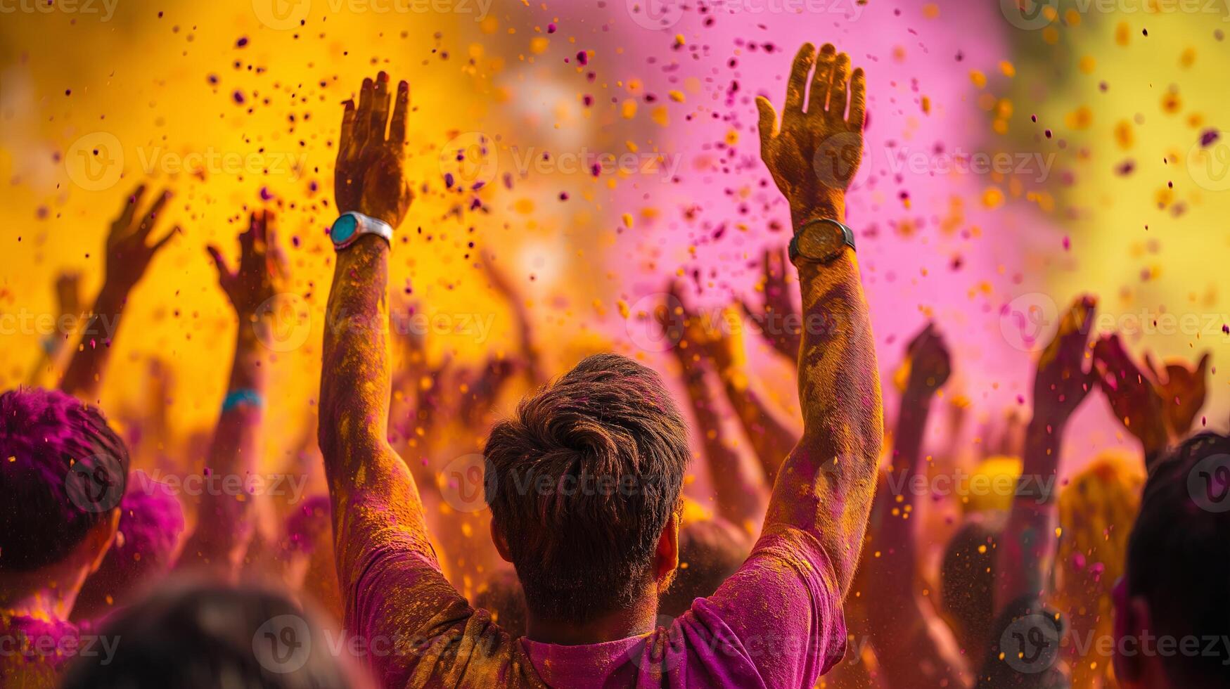 Festive crowd covered in vibrant colors, joyfully celebrating Holi with enthusiasm and unity photo
