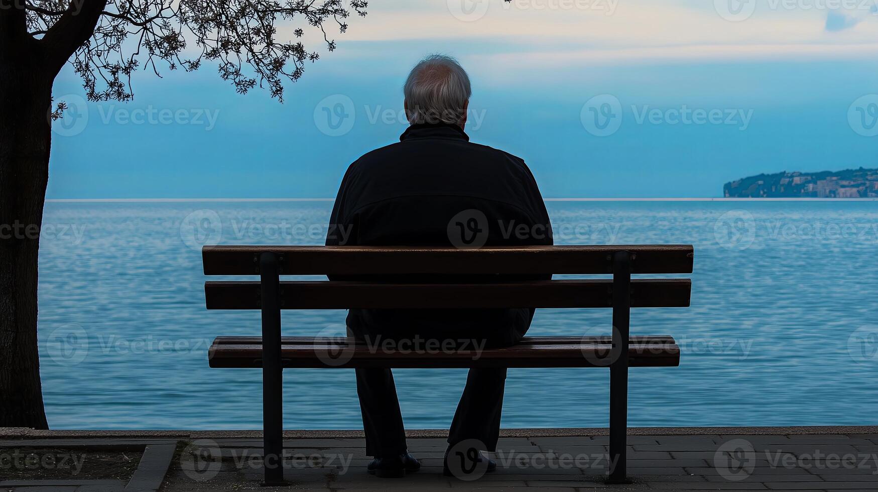 A man sitting on a bench photo