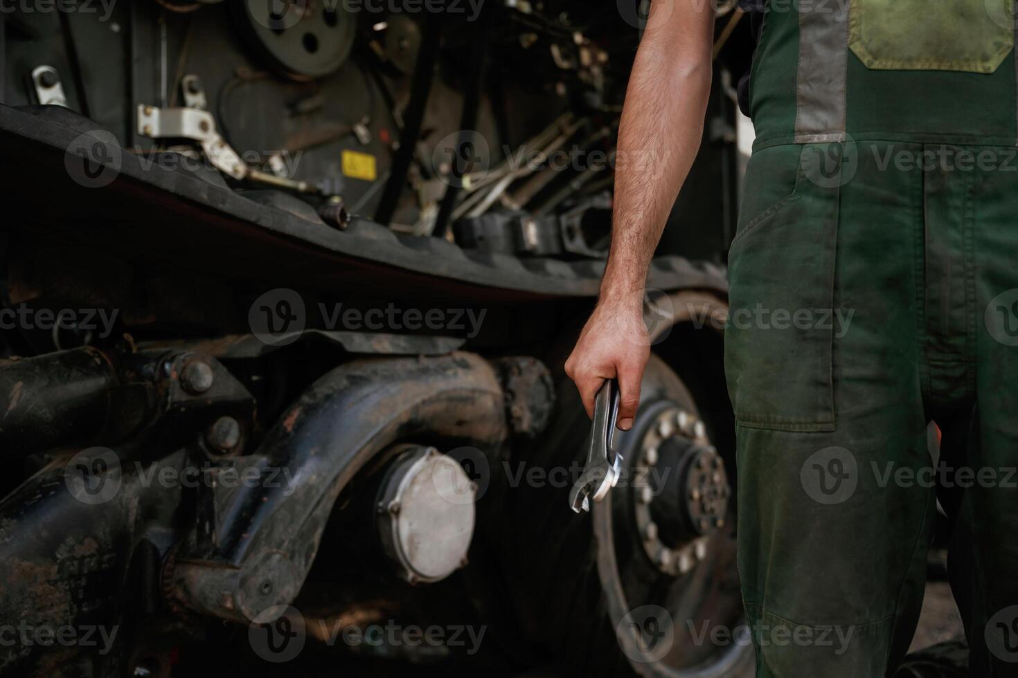 Holding wrench. Mechanic's, hand ,fixing machinery in workshop photo