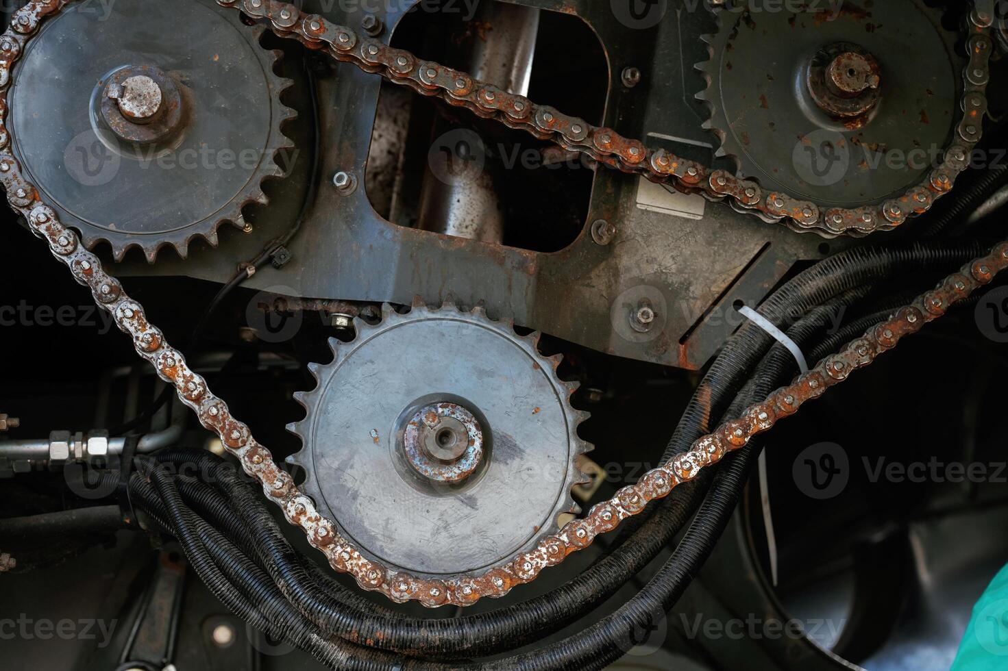 Close-up of industrial,, gears and chains in machinery photo