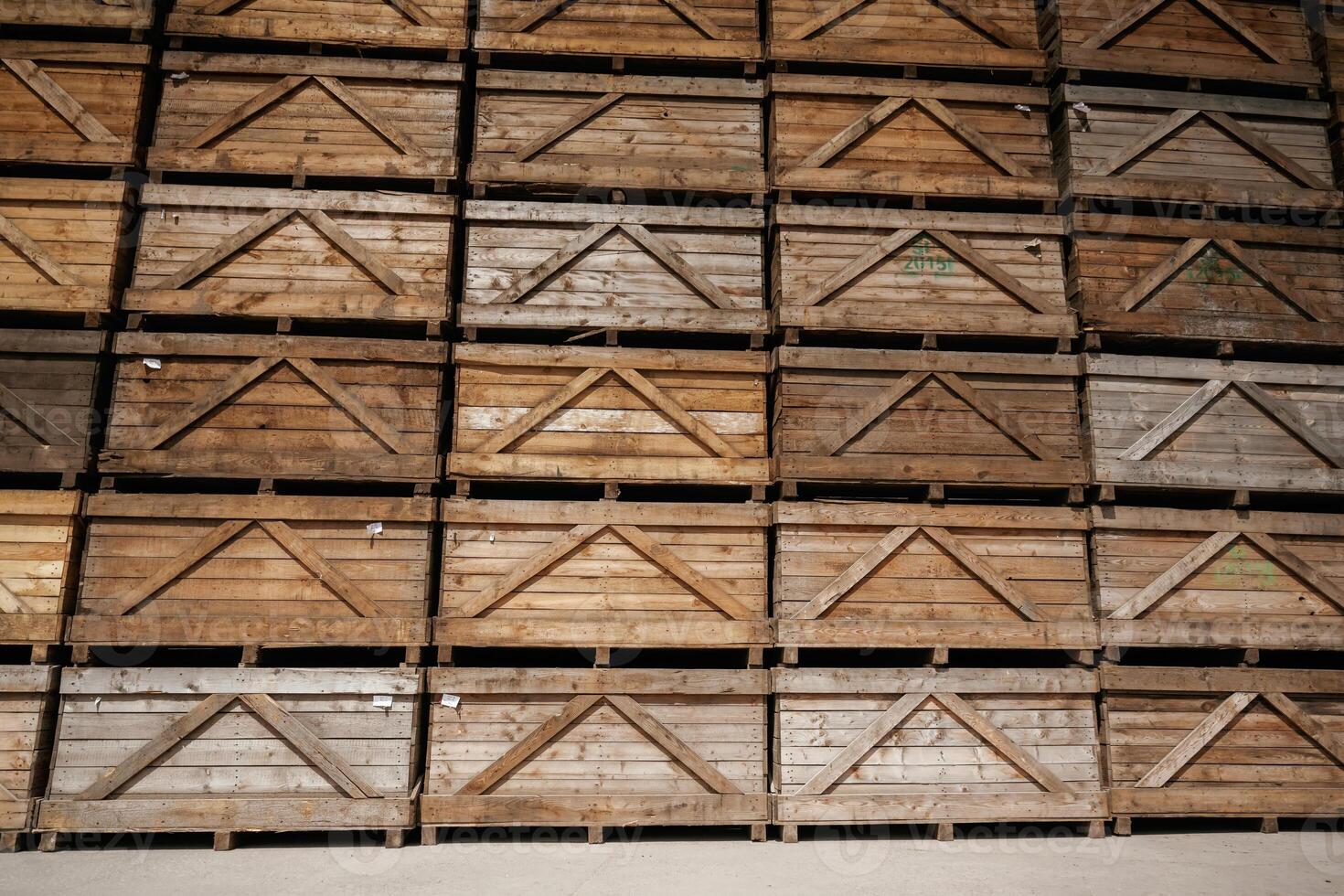 Stacked wooden, crates in an organized warehouse setting photo