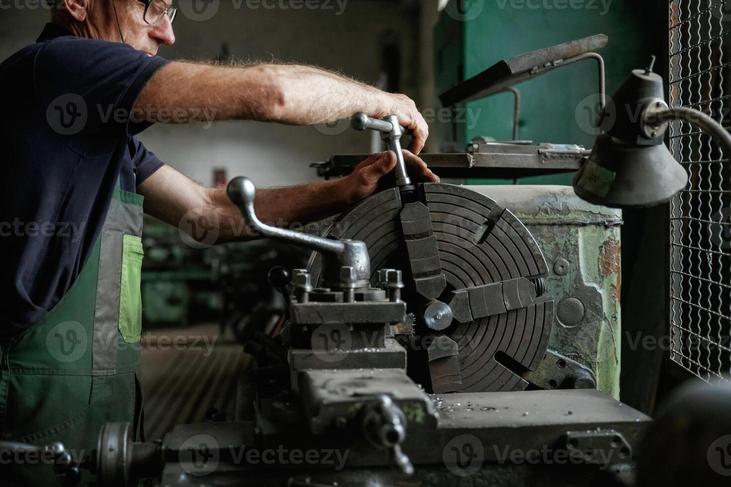 Focused view,. Close-up of worker's hands operating industrial machinery in workshop photo