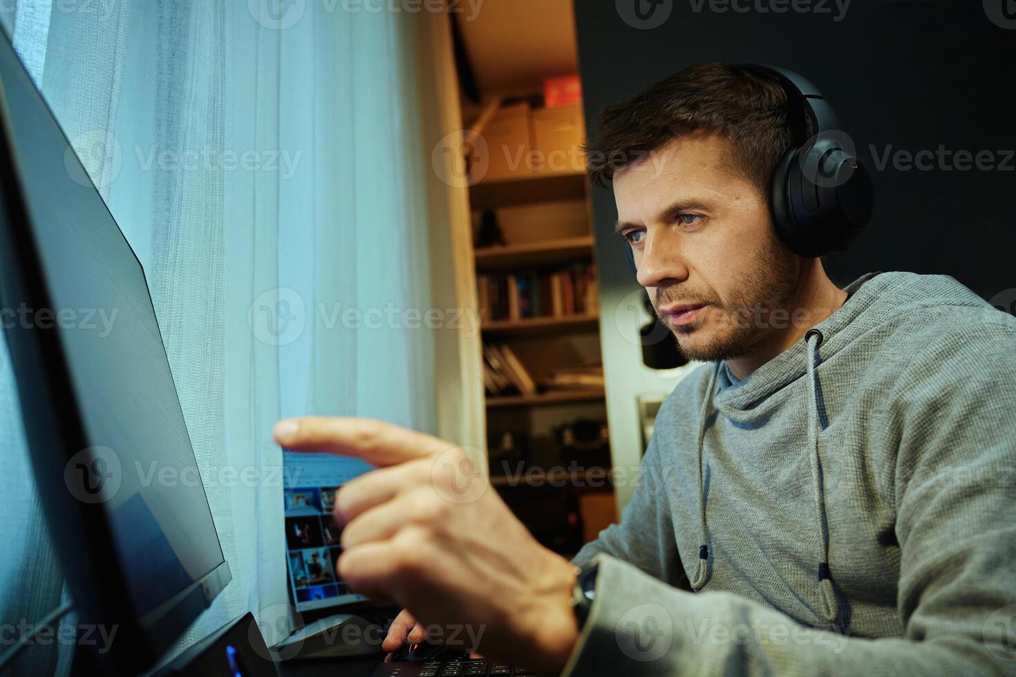 Freelancer working from home with headphones photo