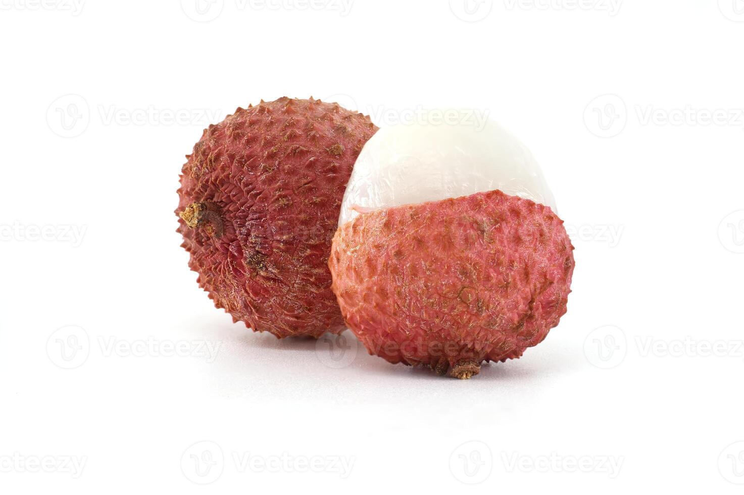 Close-Up of Fresh Lychee Fruit with Skin and Partially Peeled photo