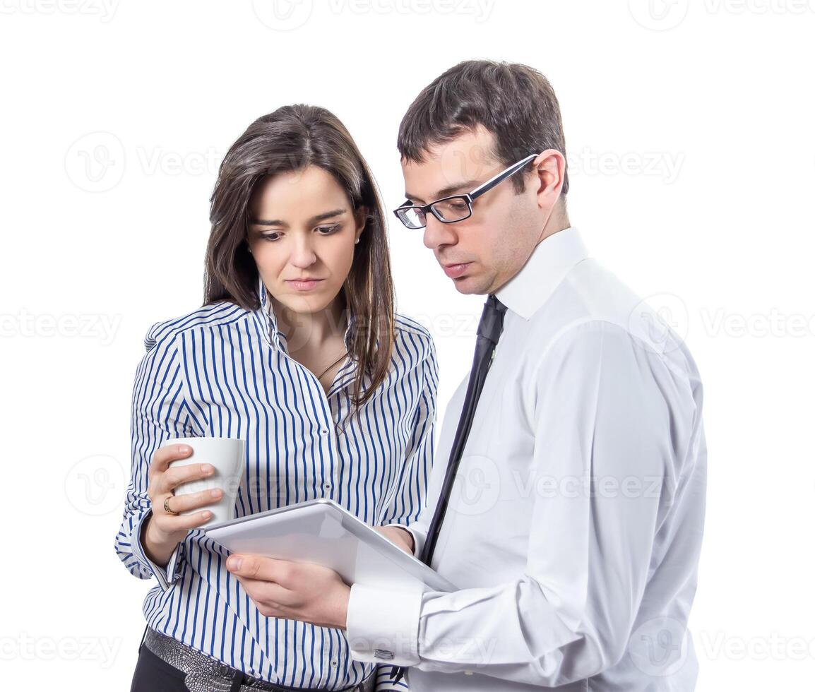 Business people reading documents in a tablet photo