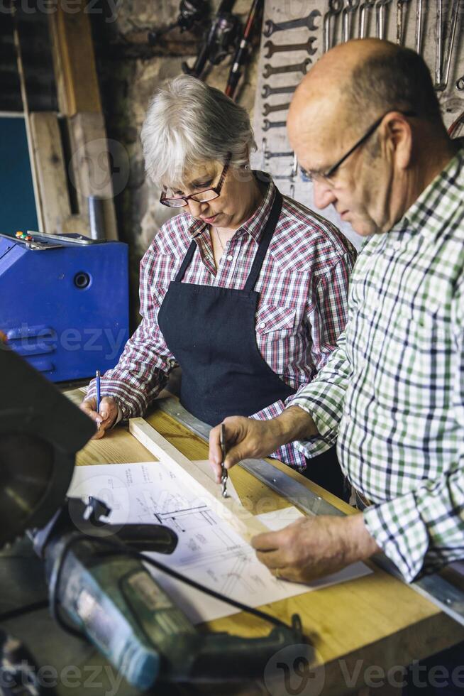 Senior couple in carpentry working photo