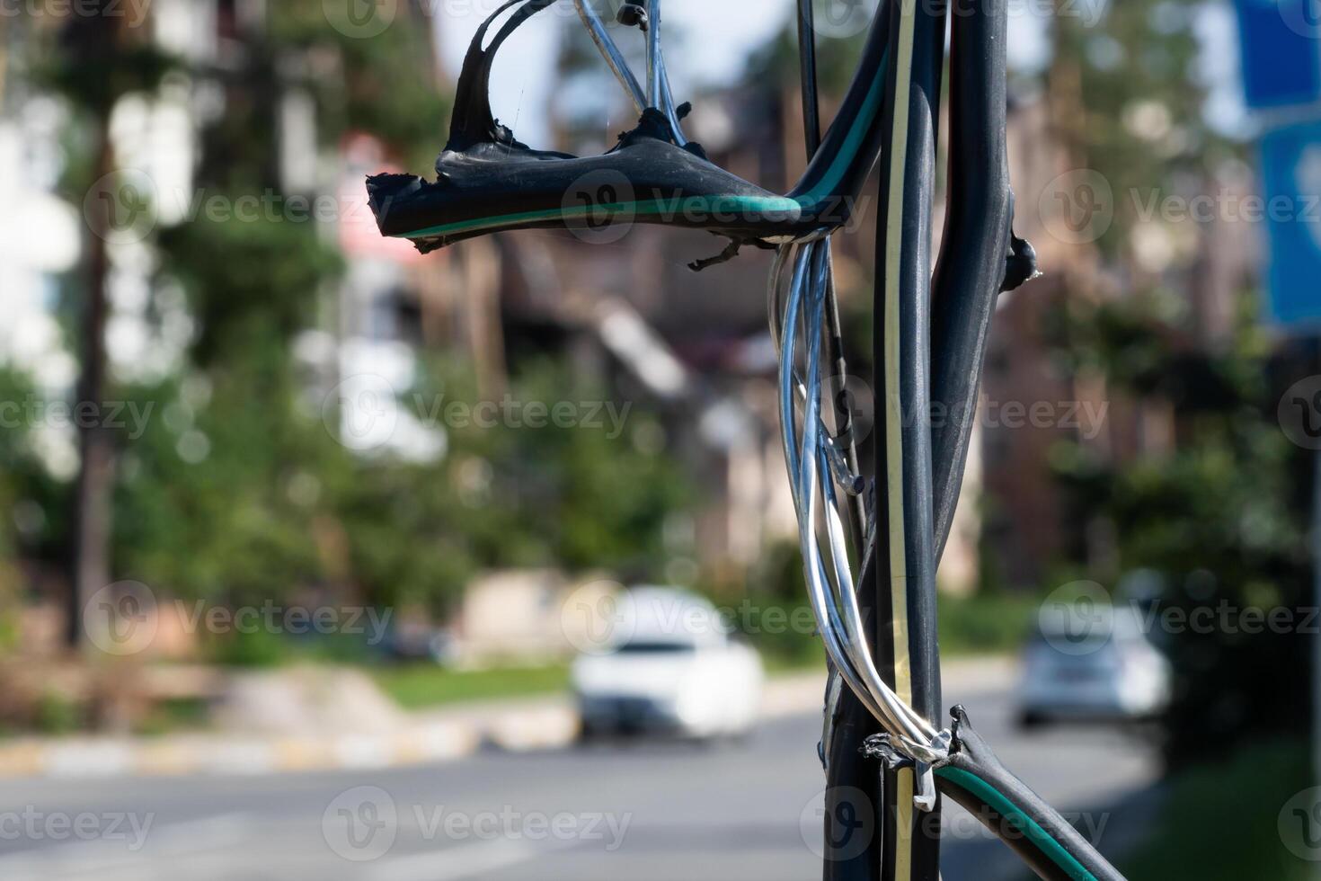 Broken black ground electric cord Dangerous damage power electrical cable that can make electric leak and shock. Unsafe work concept photo