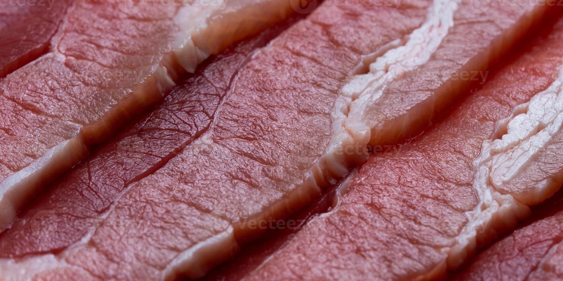 Fresh sliced collar pork raw closeup. Raw Bacon Slices. photo