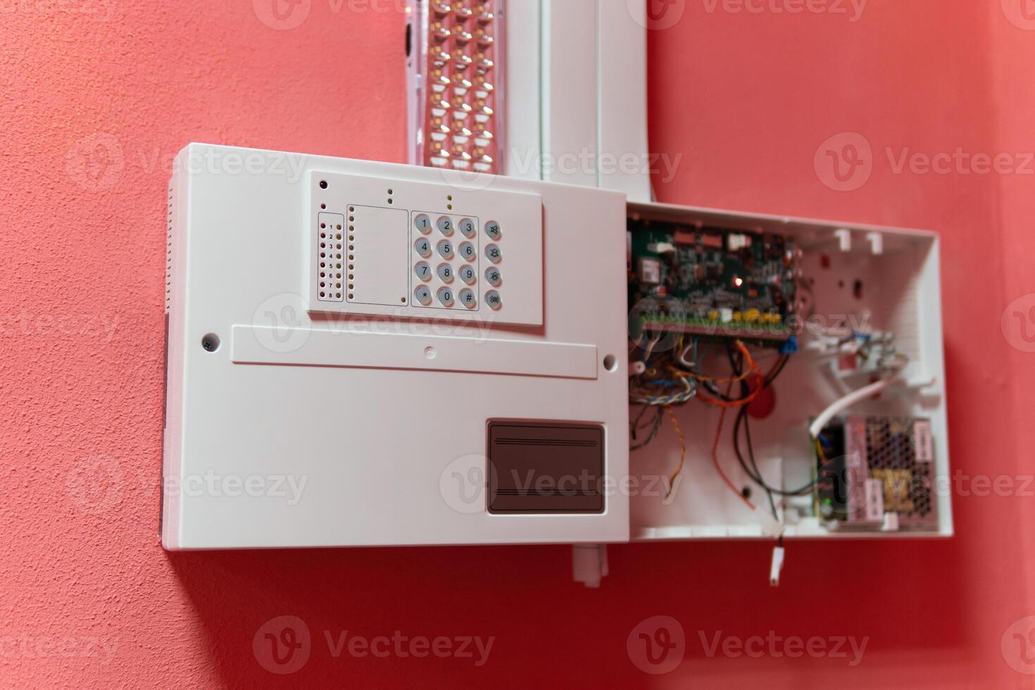 Fire alarm control panel is activated and in alert mode. Selective focus photo