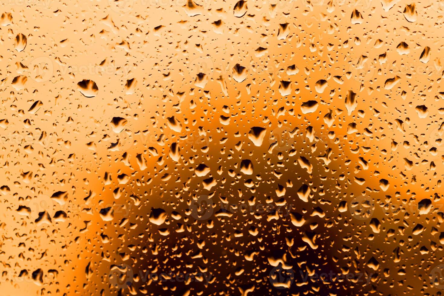 large and fine water drops on glass. photo