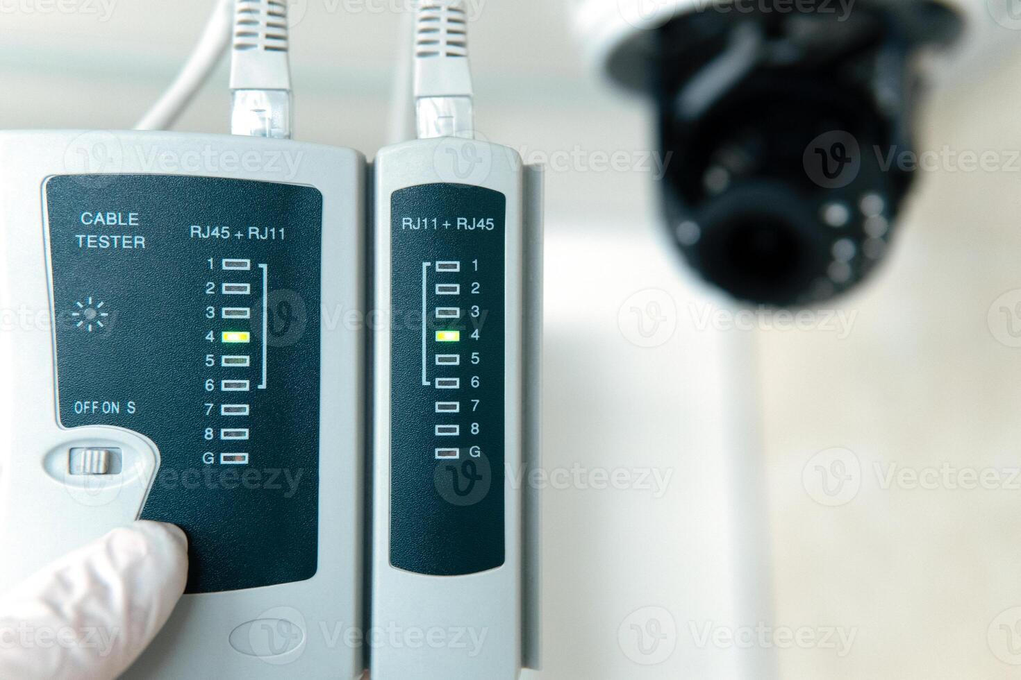 Professional cctv technician is working. A technician checks a CCTV camera. photo