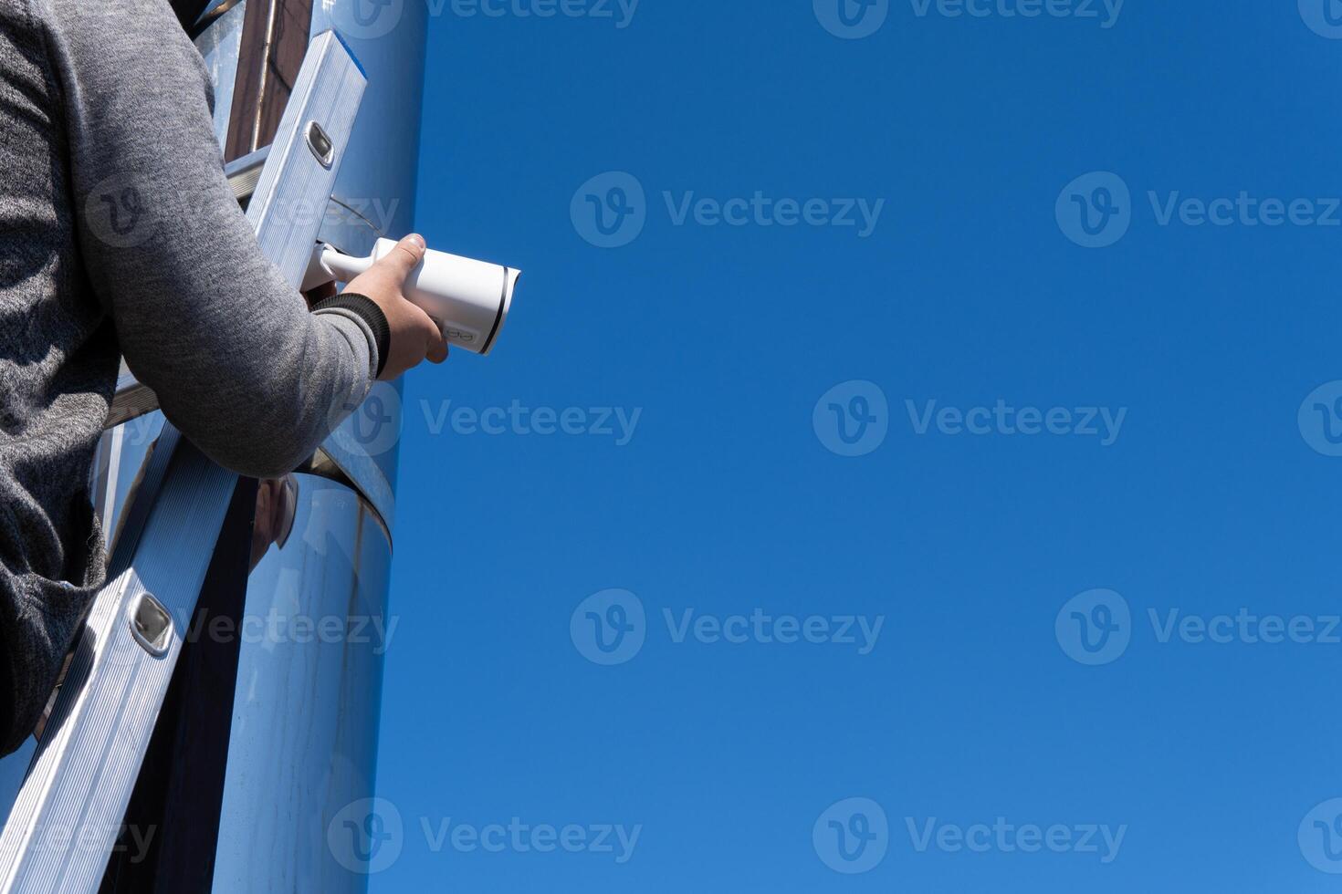 surveillance service. Camera installation technician.Maintenance photo