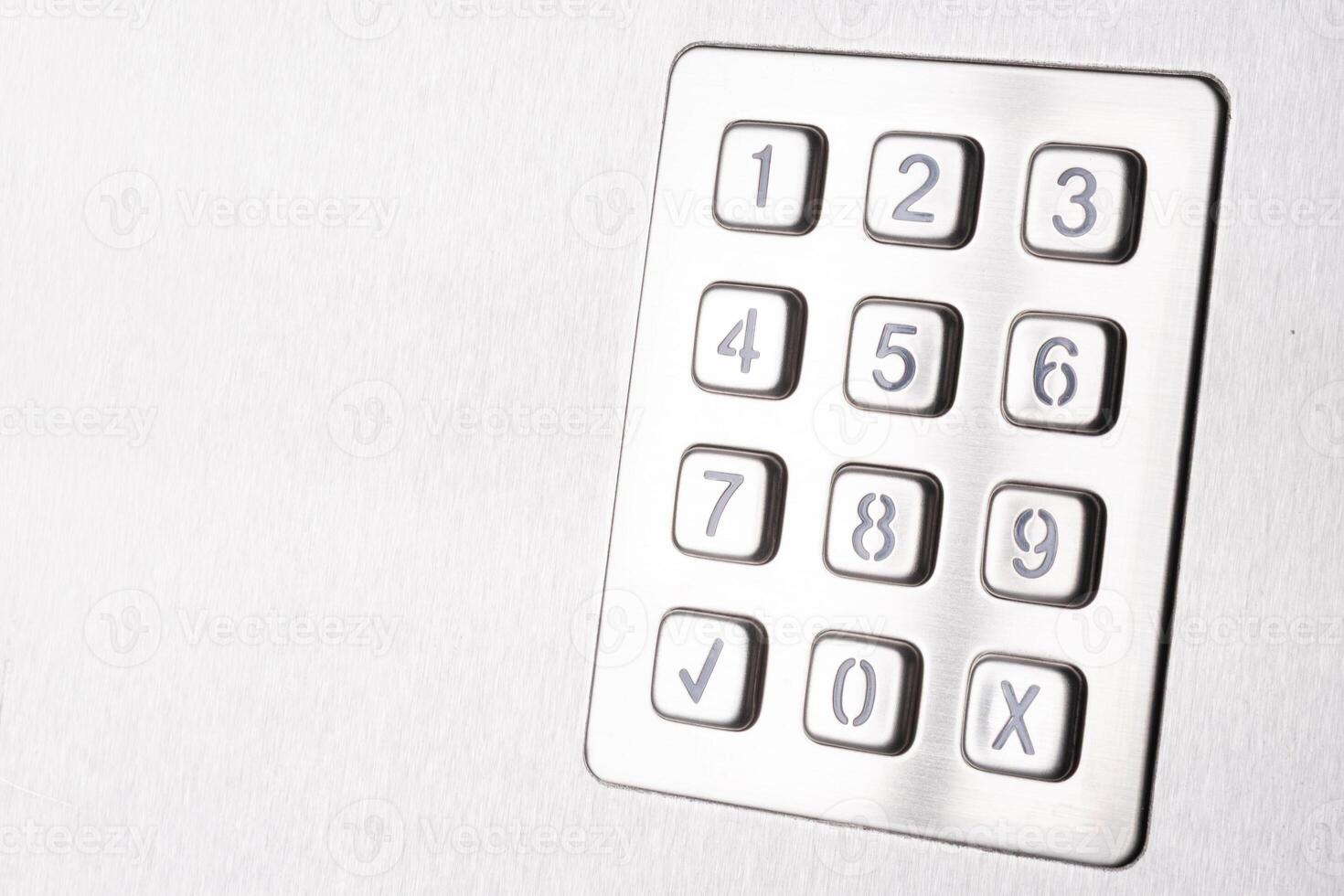 Tilted metallic numeric keypad panel photo