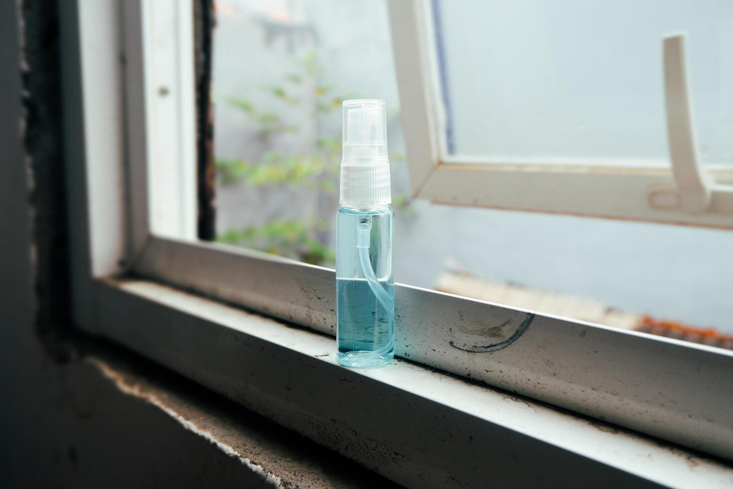 Bottle spray on the window photo