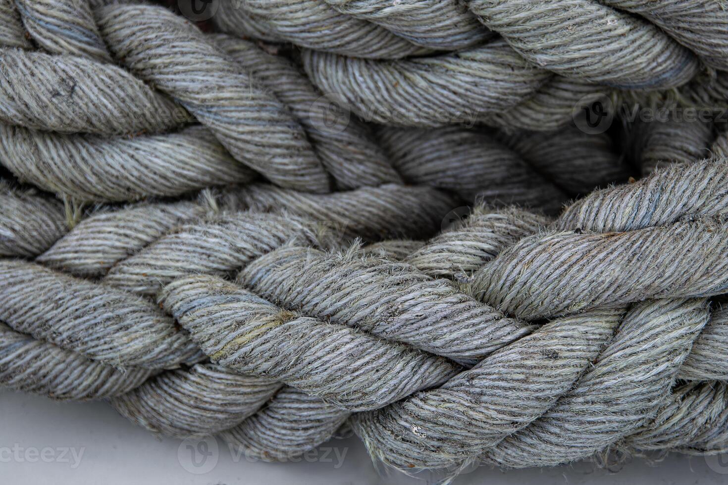 Closeup of thick braided marine rope. Coarse texture and rugged natural fibers used in shipping industry 14 photo