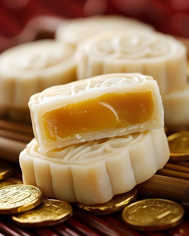 Exquisite Mooncake with Golden Filling Surrounded by Decorative Coins on a Vibrant Red Background Perfect for Celebrating Traditions and Festivals photo