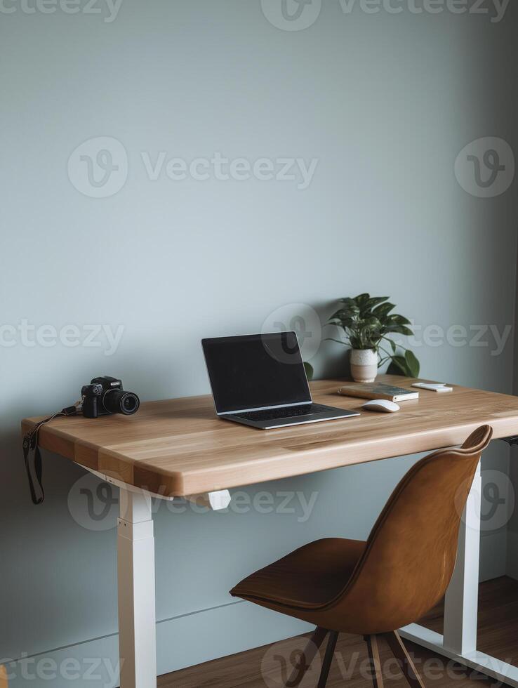 A wooden desk with a laptop on it photo