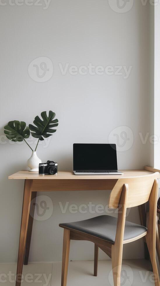 A wooden desk with a laptop and chair photo