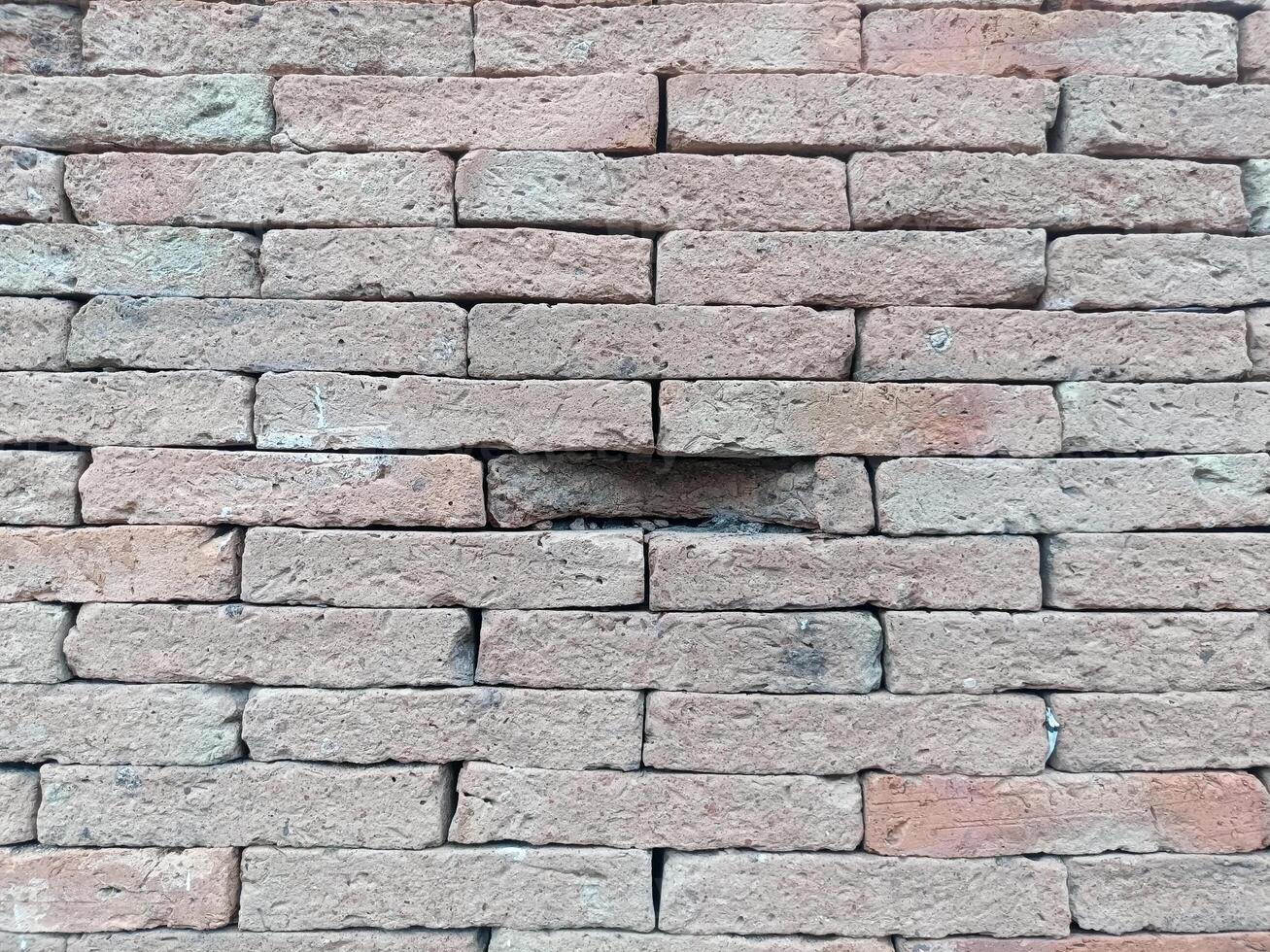 Brick wall creates rustic and strong feeling, with its textured surface providing solid and dependable construction photo