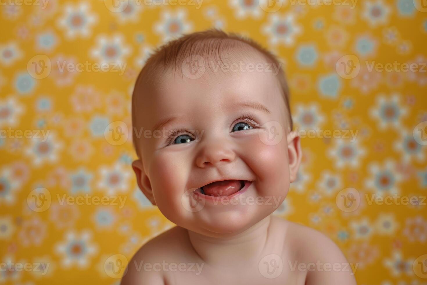 A baby is smiling in front of a floral background photo