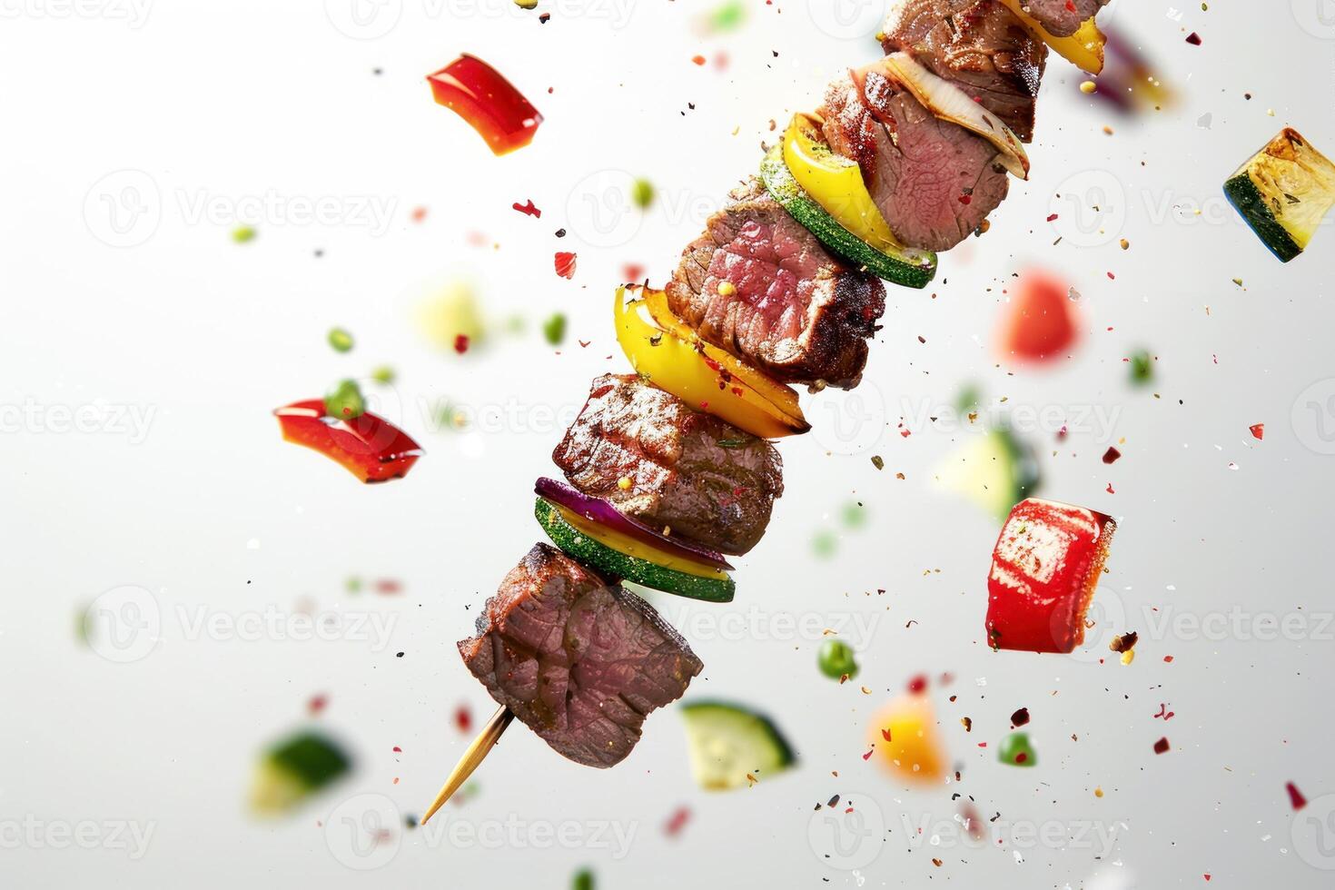 A skewer of meat and vegetables being thrown into the air photo