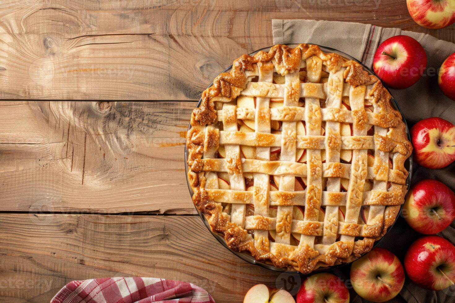 An apple pie with lattice on a wooden table photo
